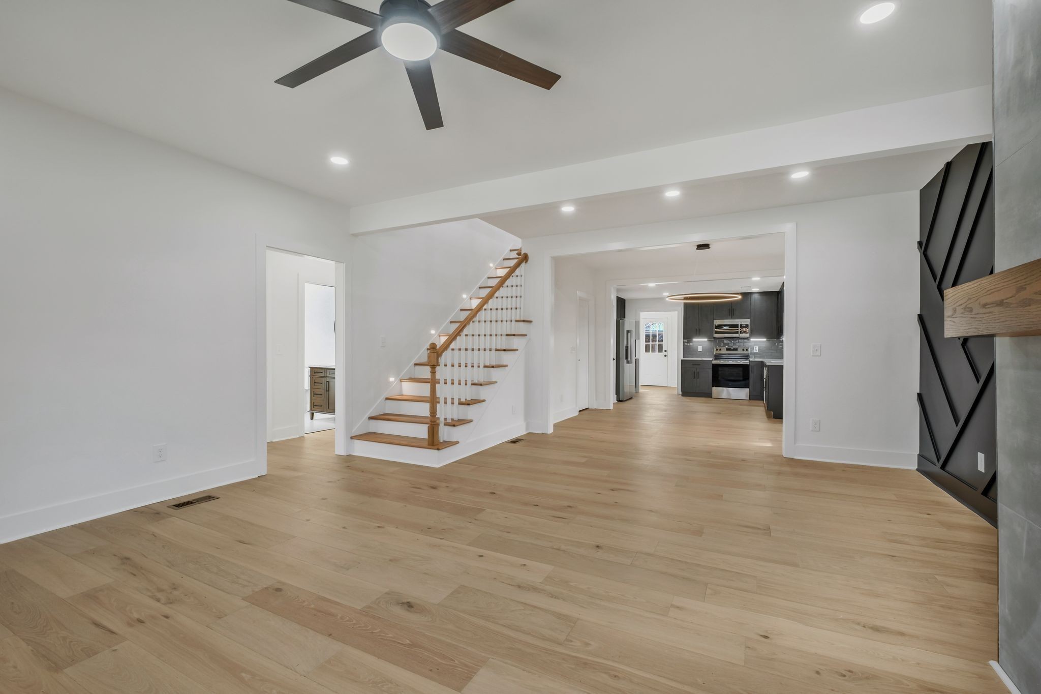 404 Rudolph Avenue Nashville, TN 37206 - Photo 5 of 34 a view of an empty room with stairs and a ceiling fan