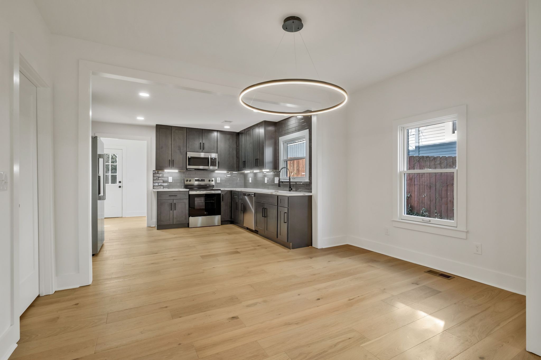 404 Rudolph Avenue Nashville, TN 37206 - Photo 7 of 34 a large kitchen with stainless steel appliances granite countertop a stove a sink dishwasher and a refrigerator
