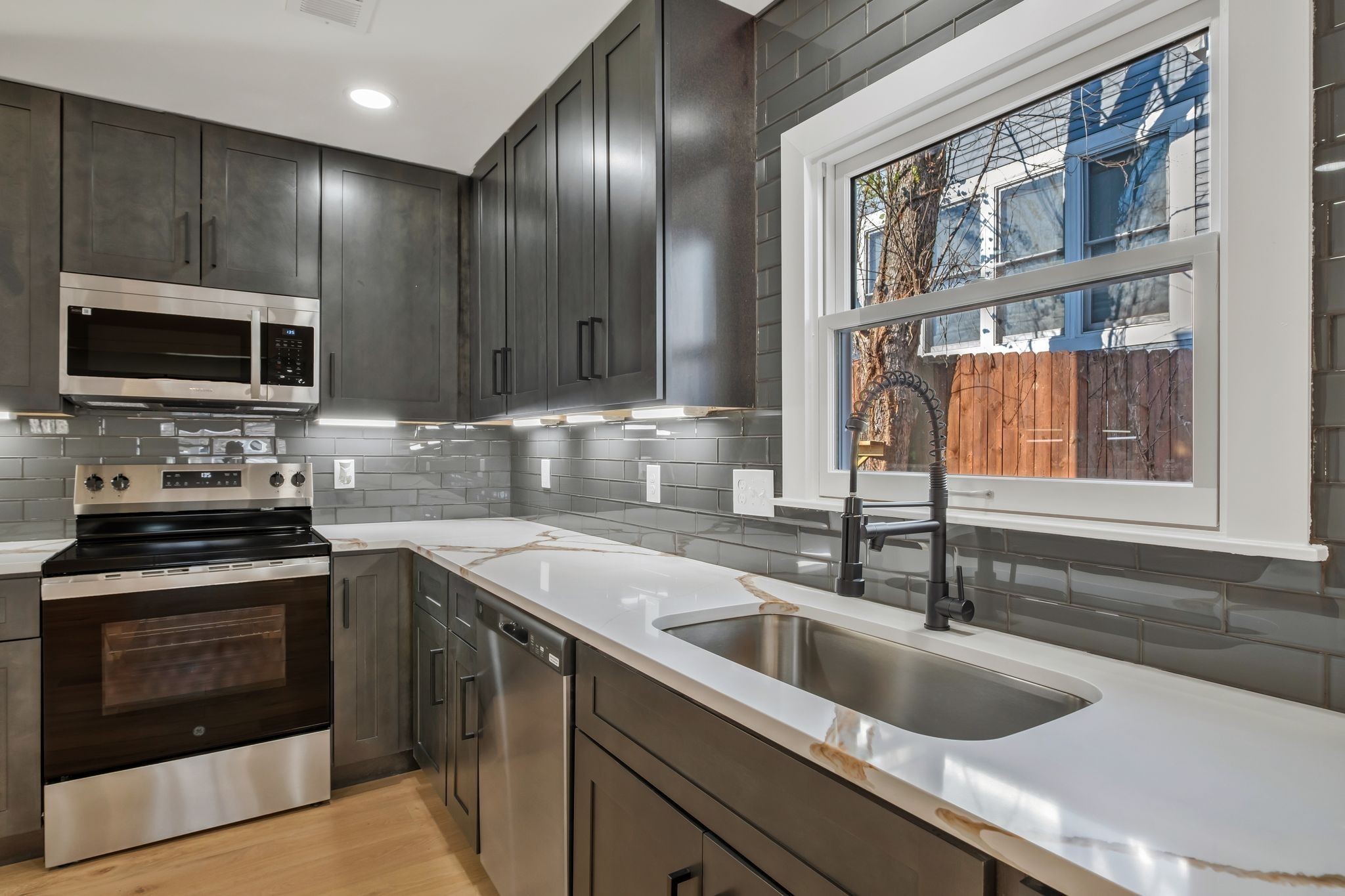 404 Rudolph Avenue Nashville, TN 37206 - Photo 9 of 34 a kitchen with a sink stove and microwave