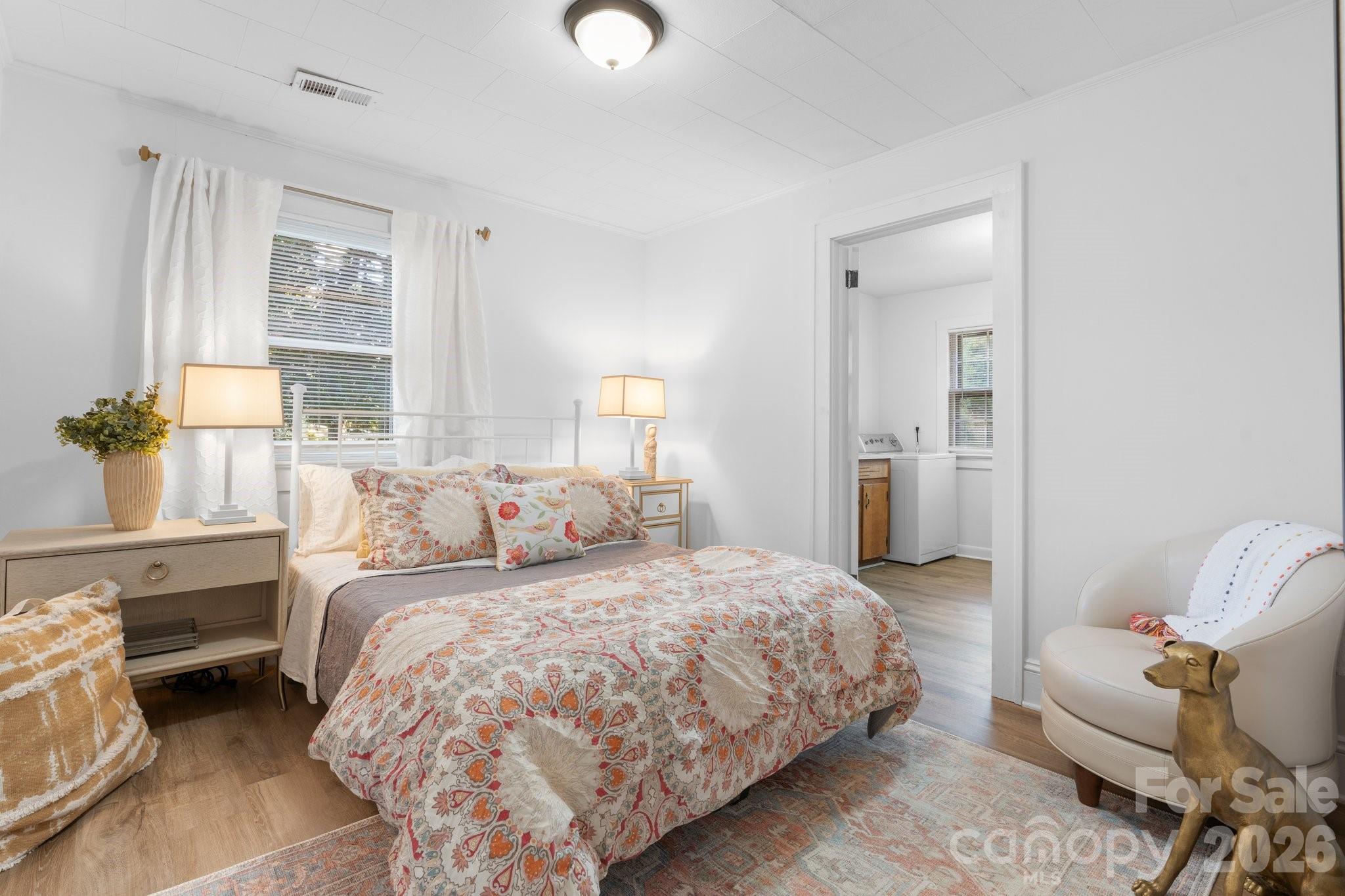 116 Barnes Lane Stony Point, NC 28678 - Photo 17 of 24 a bedroom with a bed and wooden floor