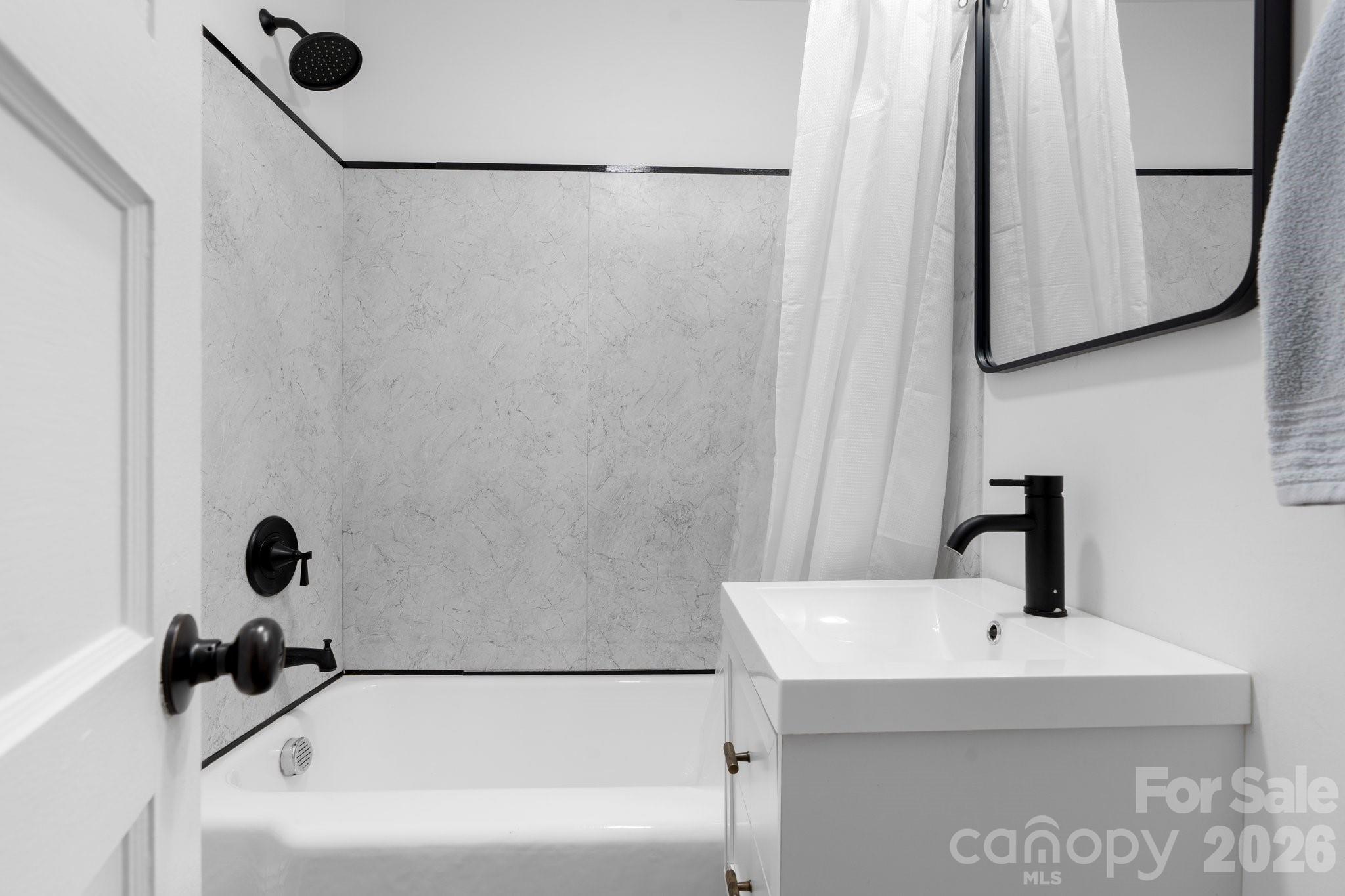 116 Barnes Lane Stony Point, NC 28678 - Photo 18 of 24 a bathroom with a sink and a mirror