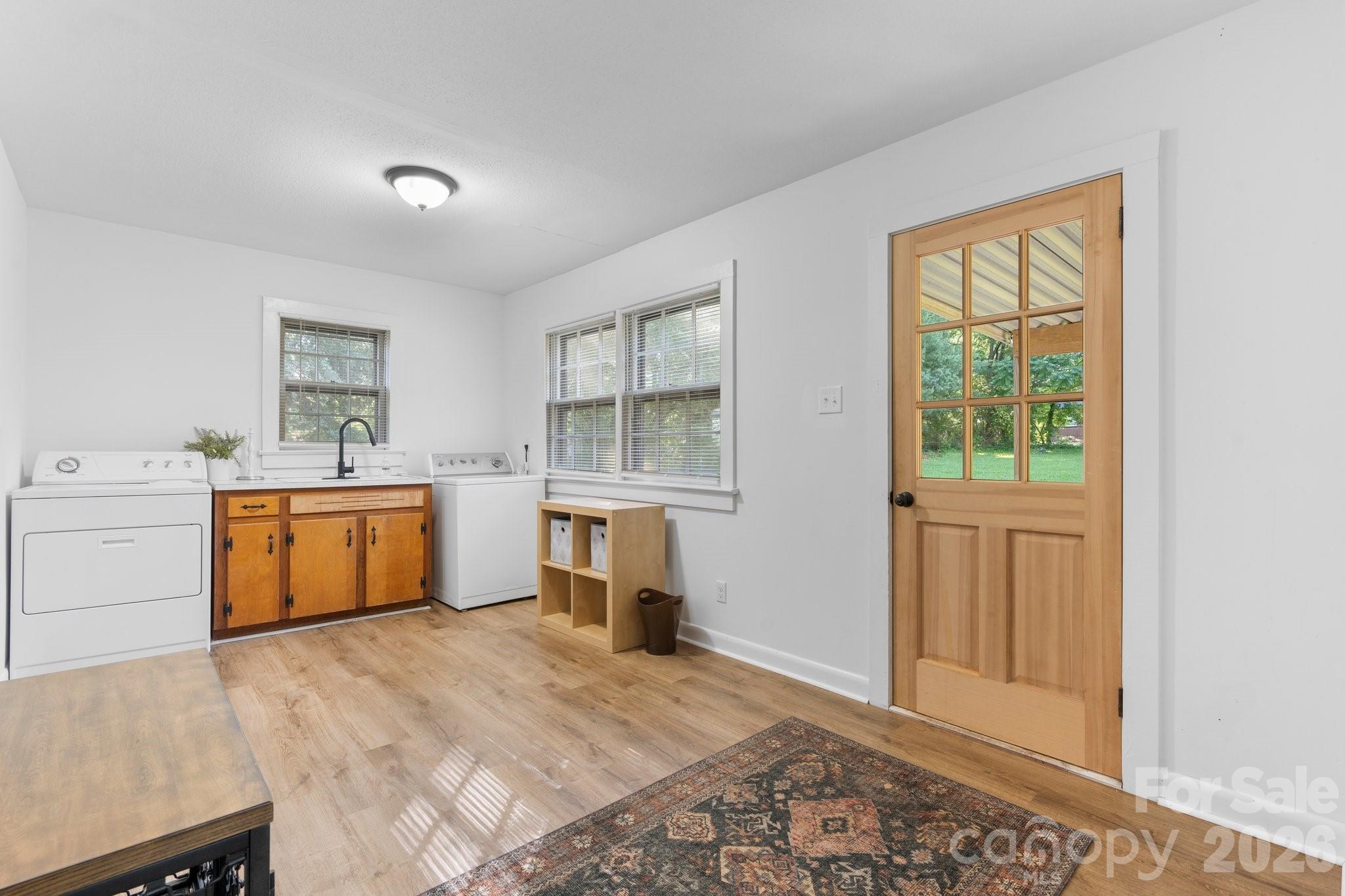 116 Barnes Lane Stony Point, NC 28678 - Photo 20 of 24 a view of a kitchen with wooden floor and electronic appliances
