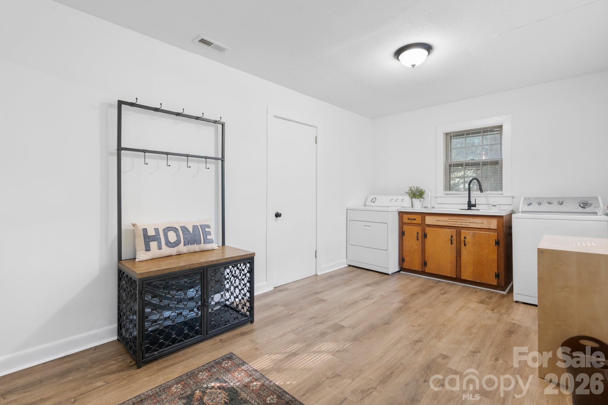 116 Barnes Lane Stony Point, NC 28678 - Photo 21 of 24 a view of a kitchen with sink cabinet and refrigerator