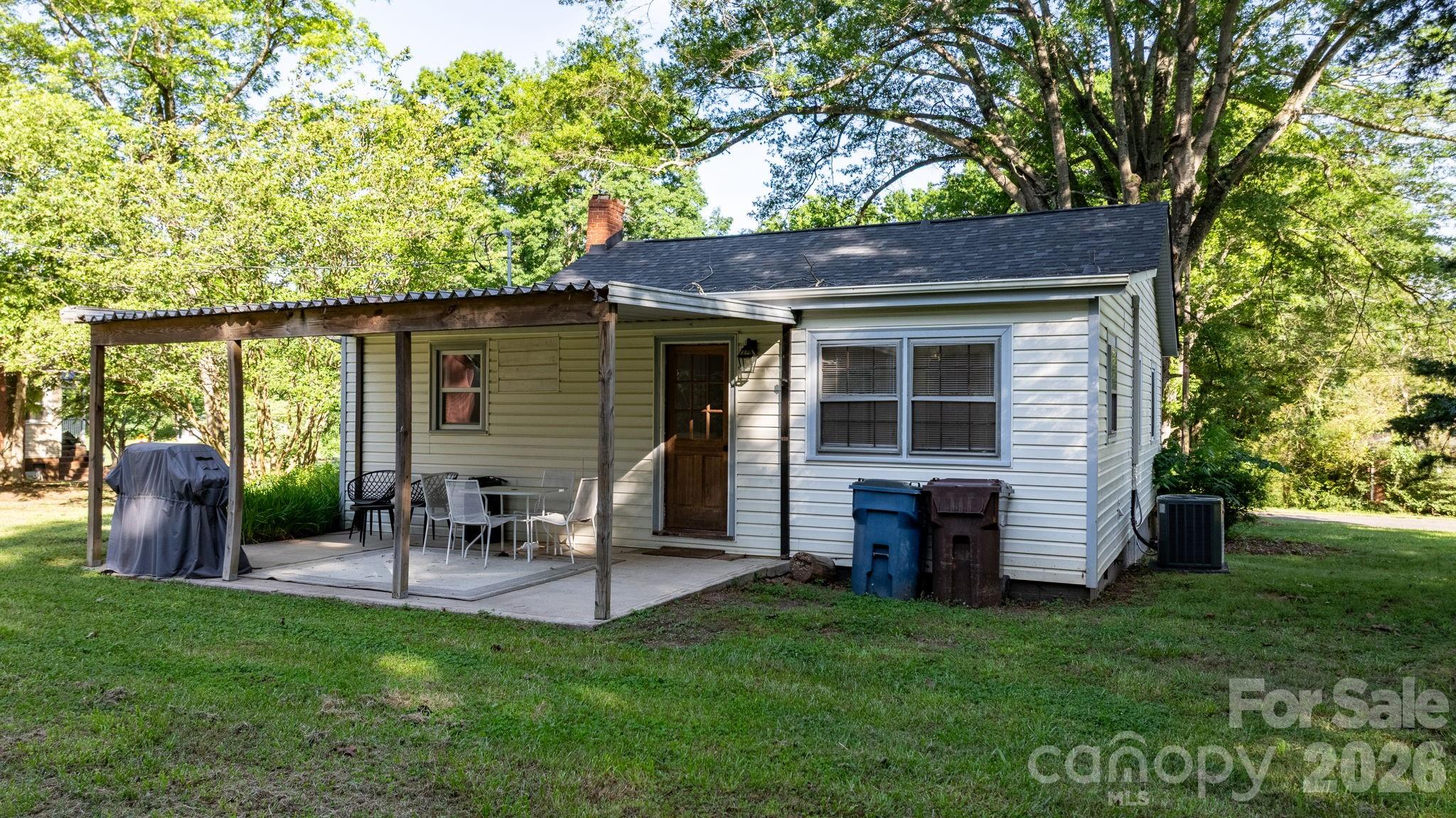 116 Barnes Lane Stony Point, NC 28678 - Photo 6 of 24 a backyard of a house with seating space