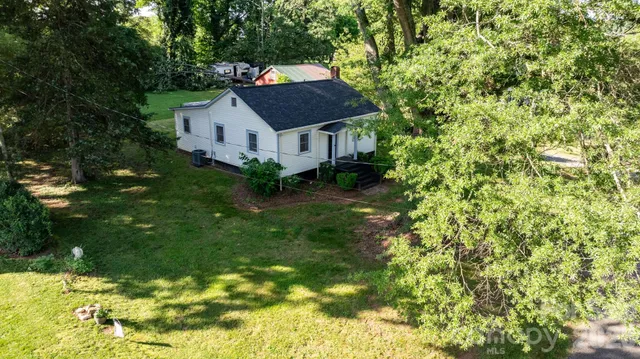 a house with a tree in front of it