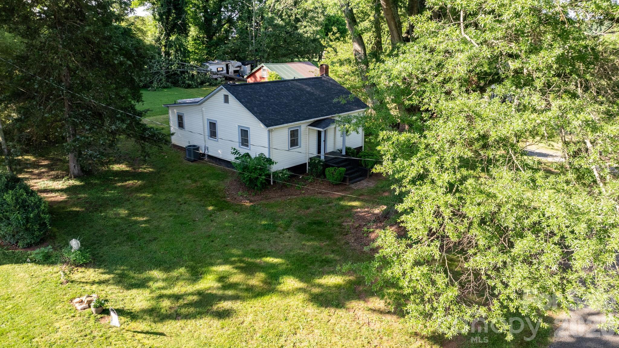 116 Barnes Lane Stony Point, NC 28678 - Photo 8 of 24 a house with a tree in front of it