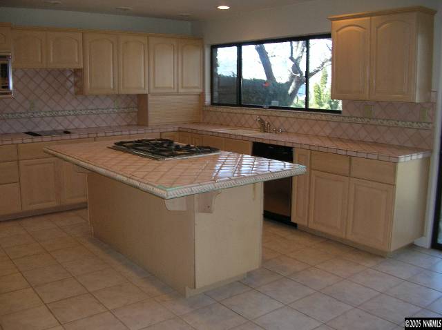 2085 Del Rio Lane Reno, NV 89509 - Photo 2 of 9 a kitchen with a stove window and cabinets