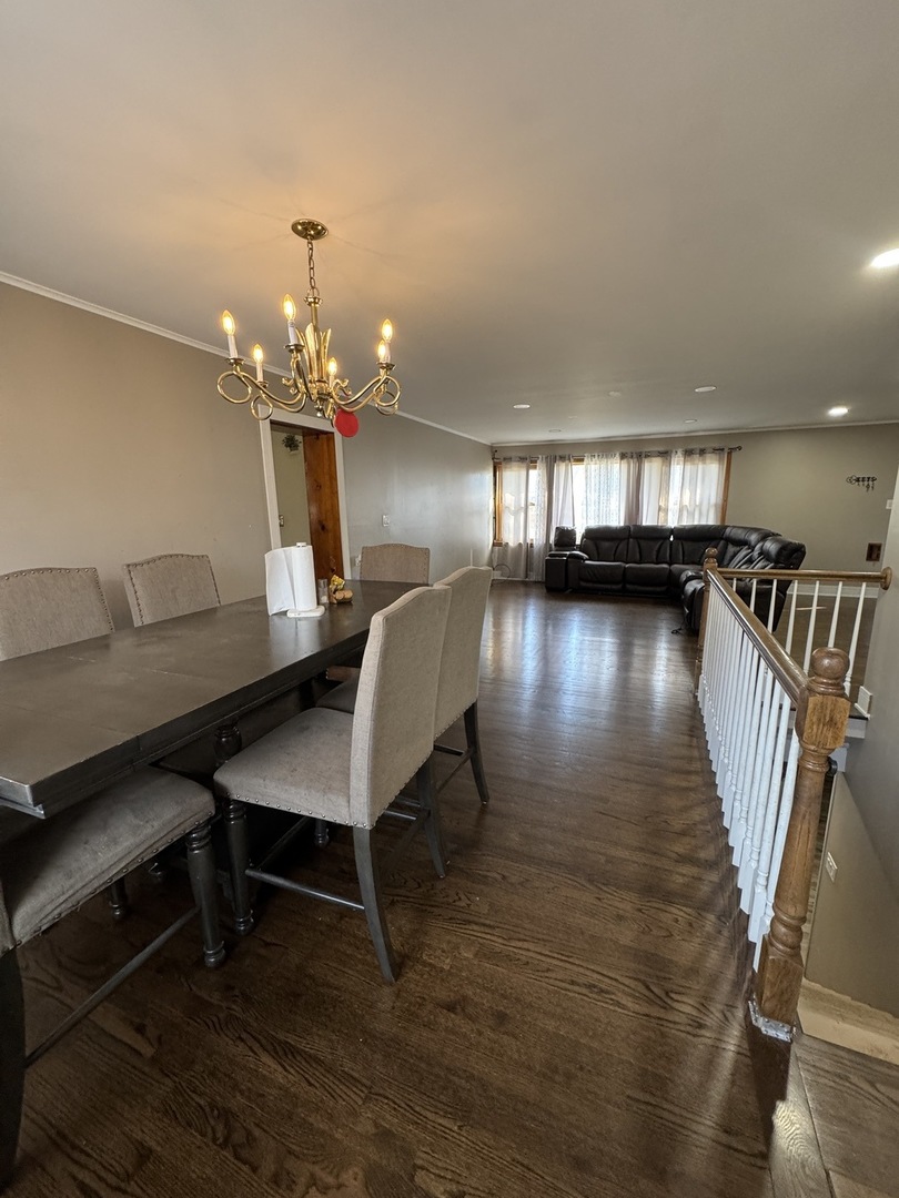5920 Chicago Avenue Berkeley, IL 60163 - Photo 3 of 13 a view of a dining room with furniture and wooden floor