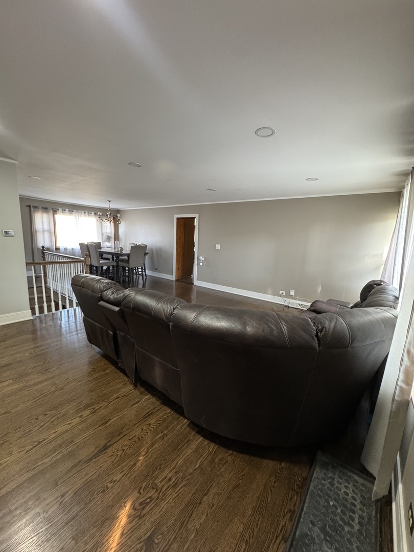 5920 Chicago Avenue Berkeley, IL 60163 - Photo 5 of 13 a living room with furniture and a wooden floor