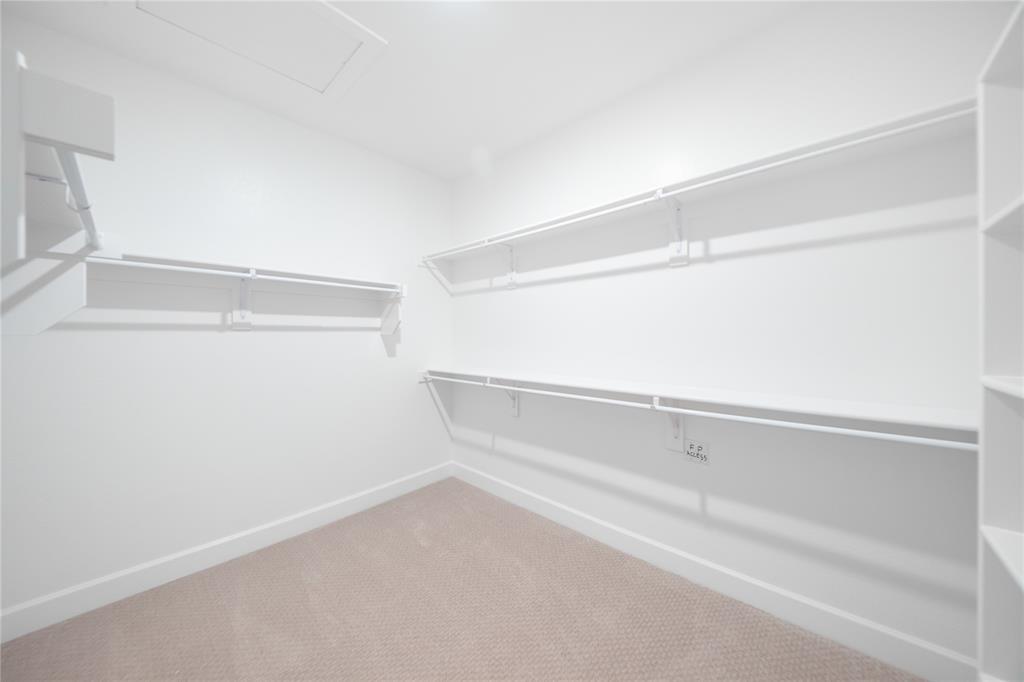2715 Triumph Court Heath, TX 75126 - Photo 12 of 30 a view of an empty walk in closet