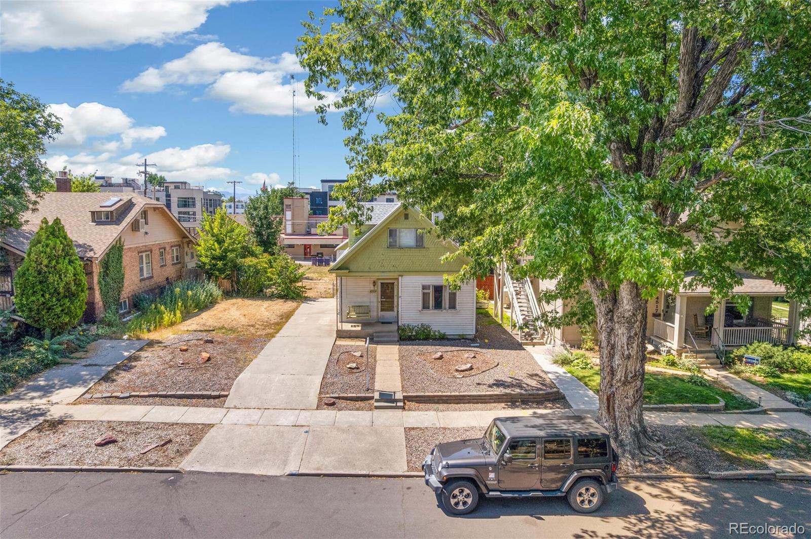 4515 Stuart Street Denver, CO 80212 - Photo 2 of 28 front view of a house with a garden