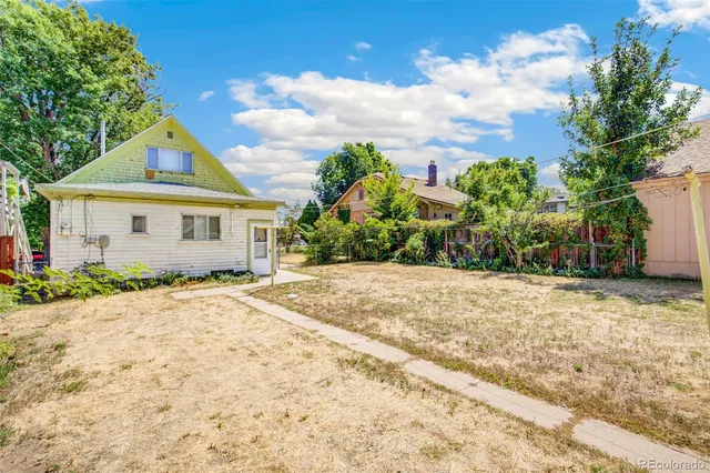 an aerial view of a residential apartment building with a yard