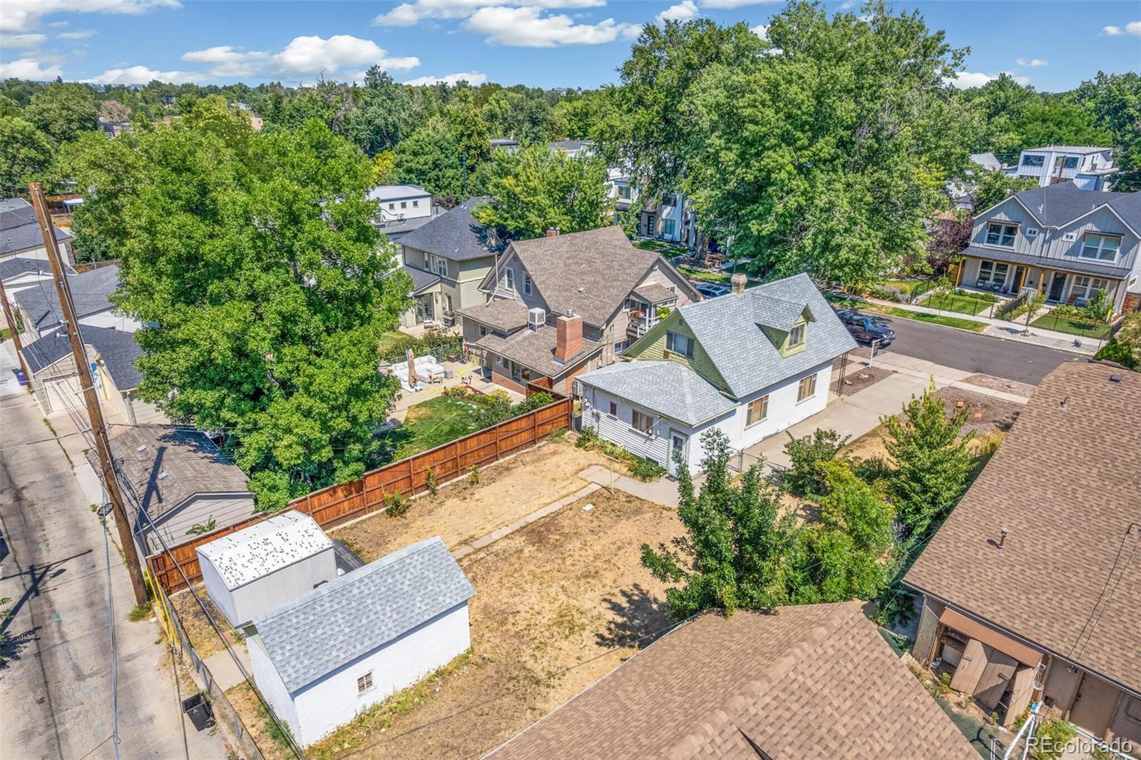 4515 Stuart Street Denver, CO 80212 - Photo 26 of 28 an aerial view of a residential apartment building with a yard