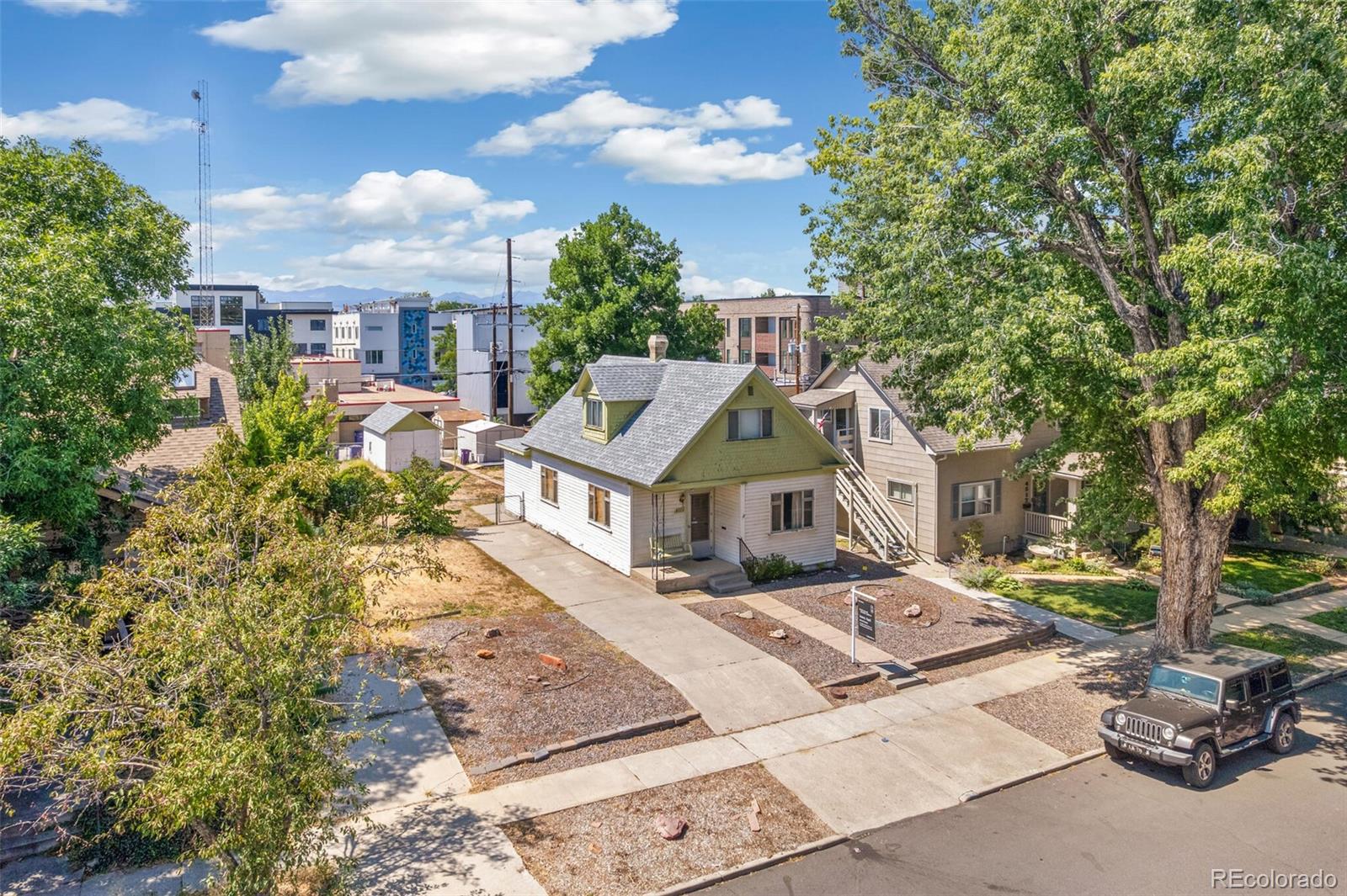 4515 Stuart Street Denver, CO 80212 - Photo 27 of 28 a front view of a house with a garden