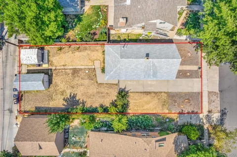 an aerial view of a house with a yard and garden