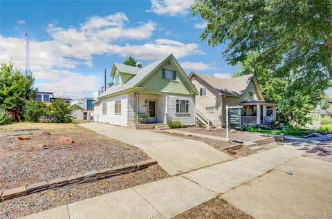 a front view of a house with yard