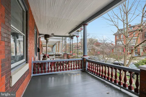 a view of a balcony with furniture