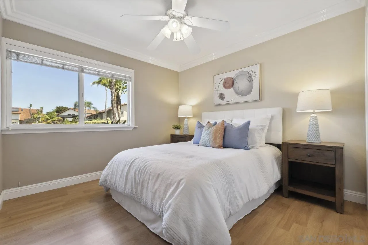304 Avenida De Los Claveles Encinitas, CA 92024 - Photo 18 of 27 a bedroom with a bed and a painting on the wall