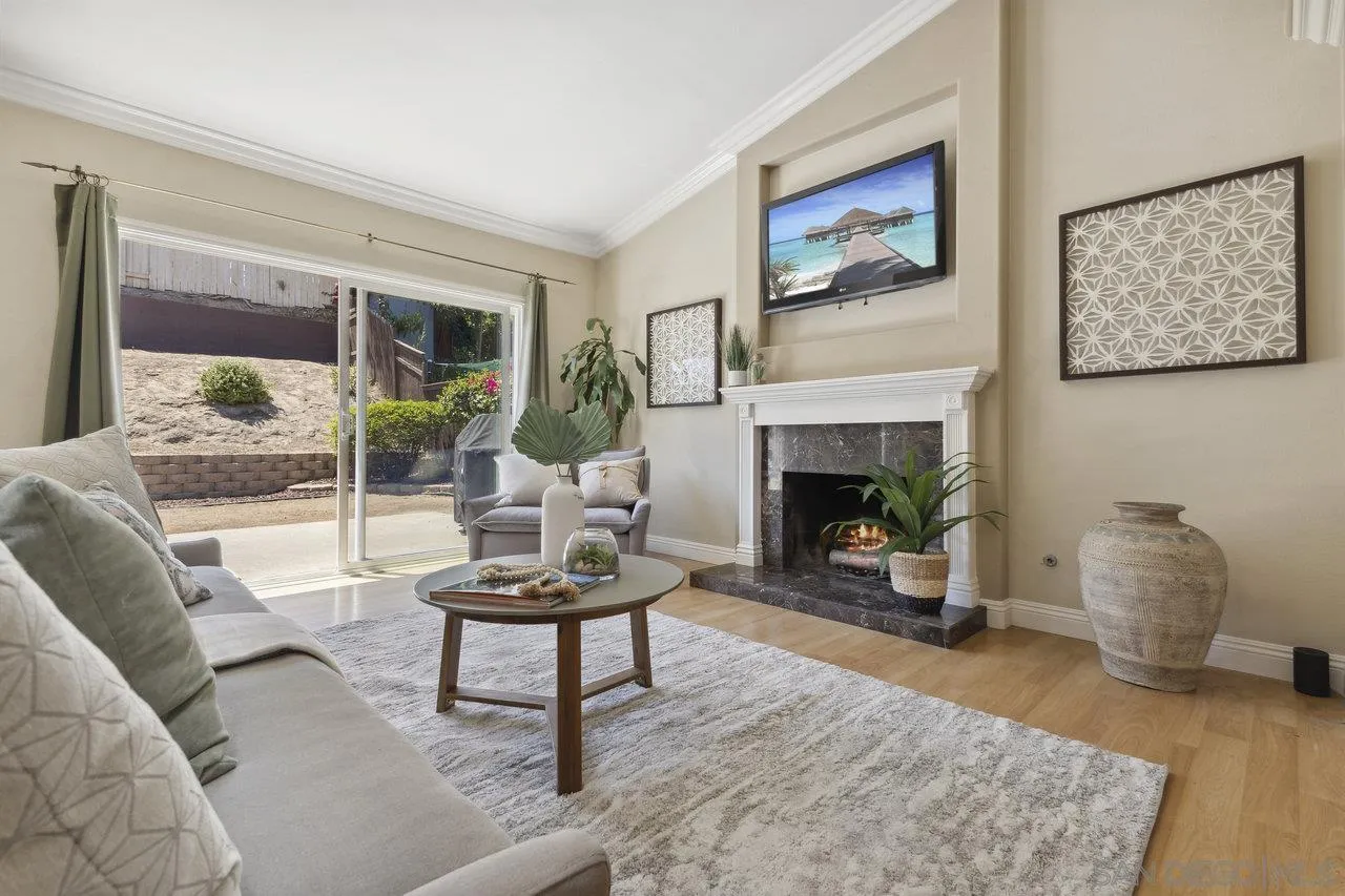 304 Avenida De Los Claveles Encinitas, CA 92024 - Photo 10 of 27 a living room with furniture and a fireplace