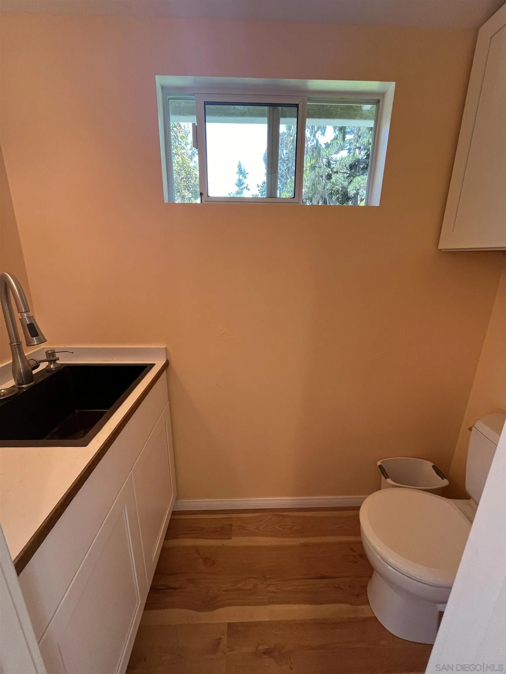 4688 Sun Valley Road Del Mar, CA 92014 - Photo 16 of 40 a bathroom with a sink and a toilet