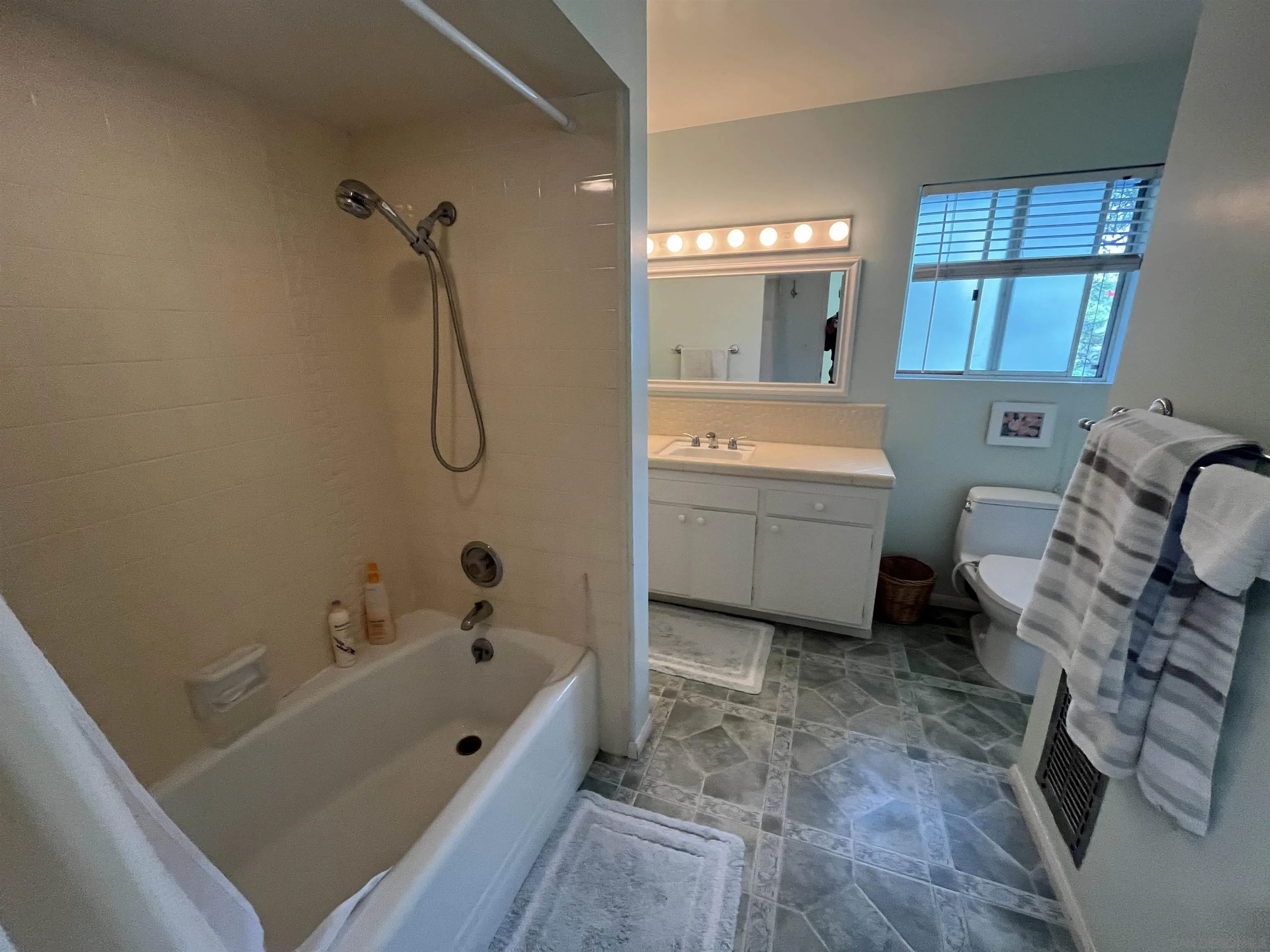 4688 Sun Valley Road Del Mar, CA 92014 - Photo 21 of 40 a bathroom with a tub a toilet and a shower