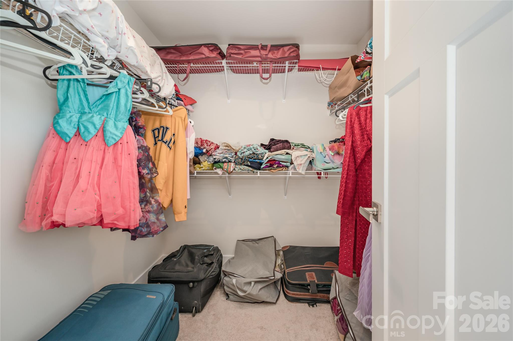 7222 Waterwheel Street Southwest Concord, NC 28025 - Photo 33 of 48 a view of walk in closet with clothes and shoes