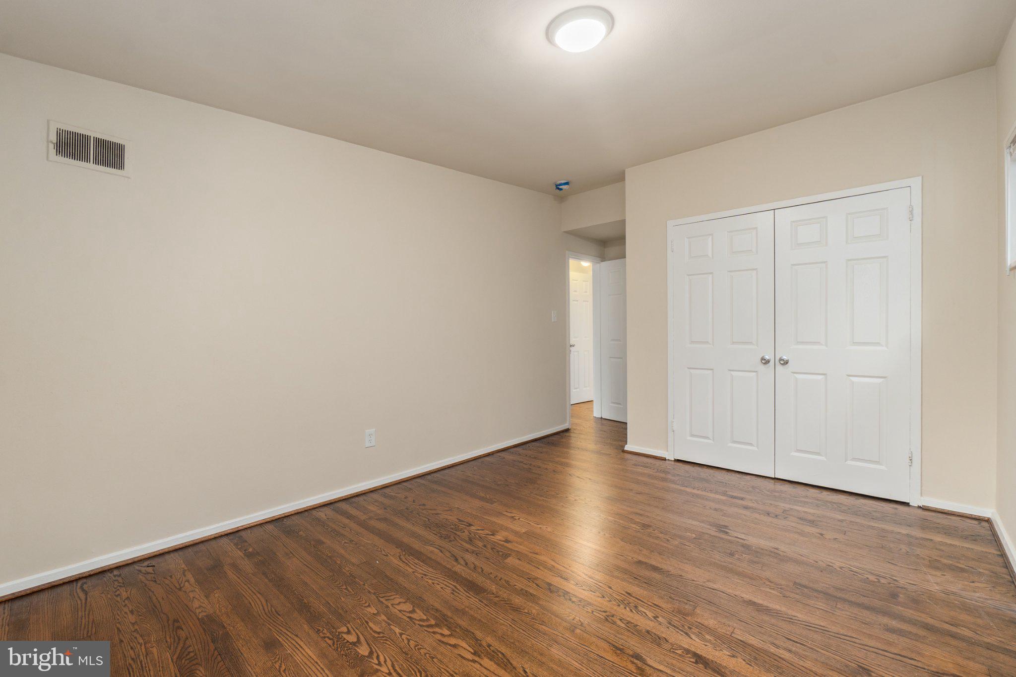 1029 Quebec Terrace, Unit 8 Silver Spring, MD 20903 - Photo 11 of 21 Spacious room with warm wood floors.