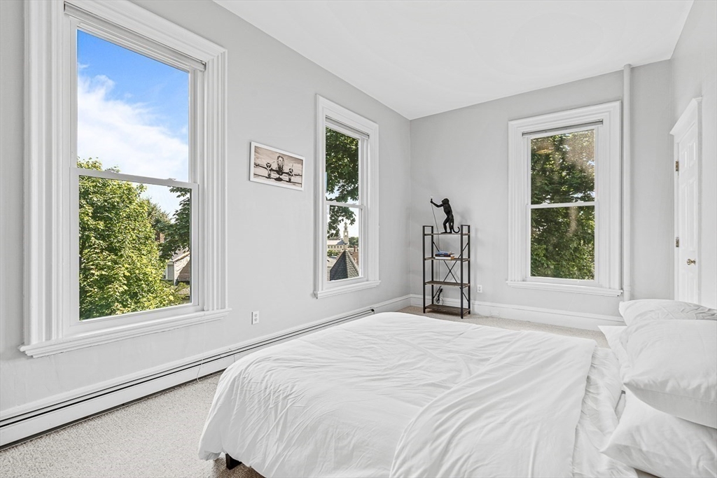 5 Babson Street, Unit 2 Gloucester, MA 01930 - Photo 13 of 23 a bedroom with a bed and a window
