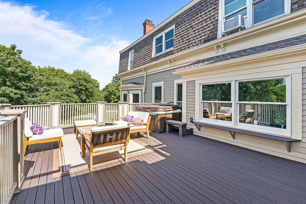 5 Babson Street, Unit 2 Gloucester, MA 01930 - Photo 16 of 23 a roof deck with a table and chairs