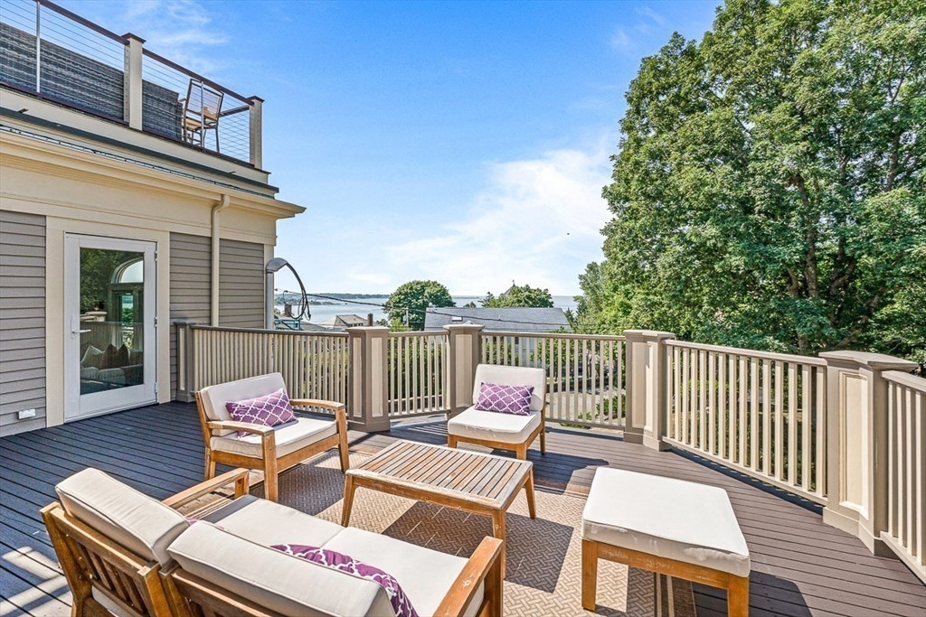 5 Babson Street, Unit 2 Gloucester, MA 01930 - Photo 18 of 23 a view of a patio with two chairs and a table