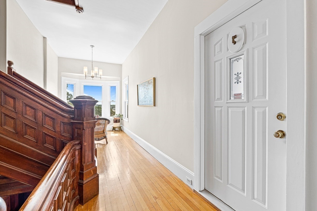 5 Babson Street, Unit 2 Gloucester, MA 01930 - Photo 19 of 23 a view of a hallway with wooden floor and staircase