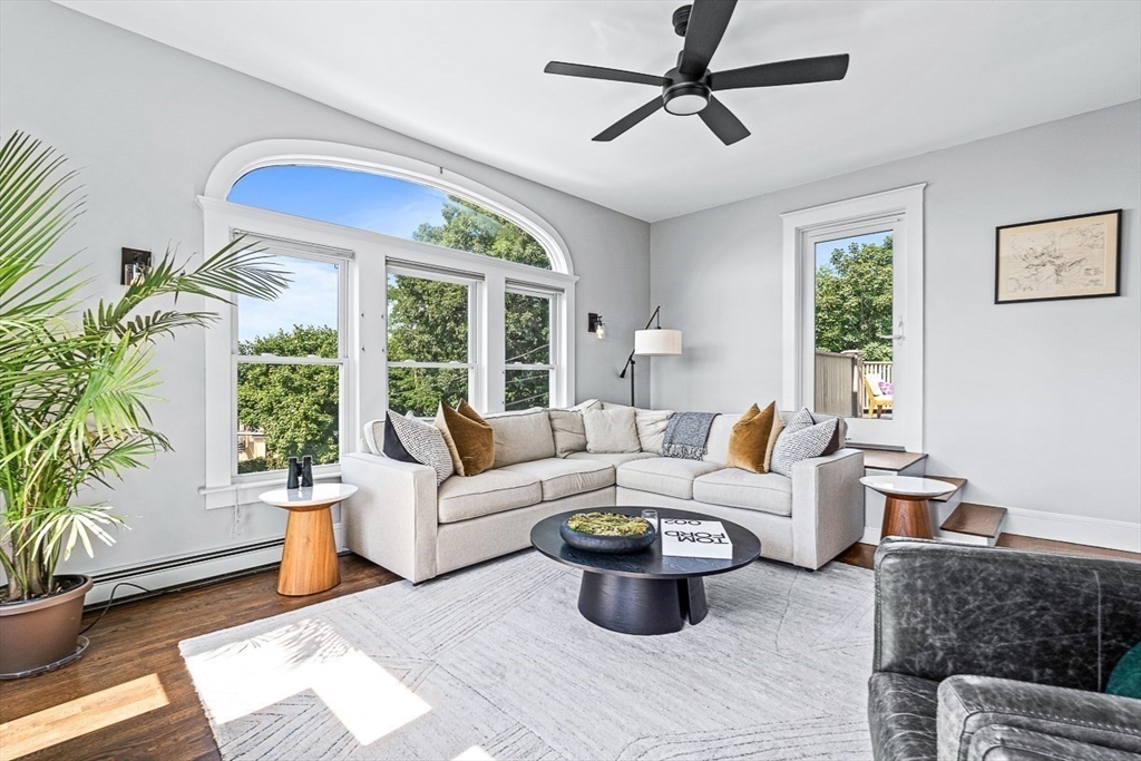 5 Babson Street, Unit 2 Gloucester, MA 01930 - Photo 2 of 23 a living room with furniture potted plant and a window