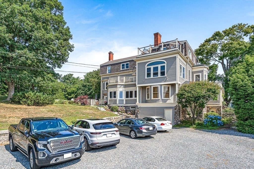 5 Babson Street, Unit 2 Gloucester, MA 01930 - Photo 21 of 23 a view of a car parked in front of a house