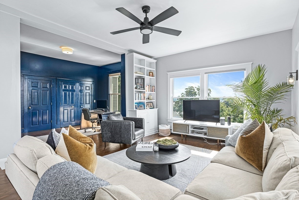 5 Babson Street, Unit 2 Gloucester, MA 01930 - Photo 3 of 23 a living room with furniture and a flat screen tv