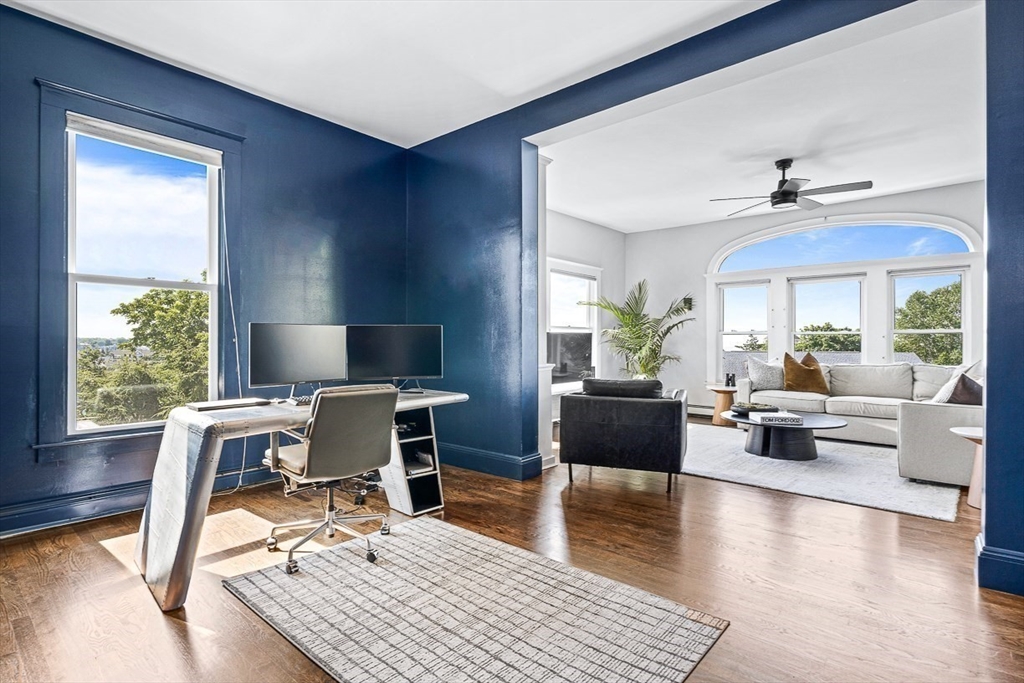 5 Babson Street, Unit 2 Gloucester, MA 01930 - Photo 4 of 23 a work room with furniture wooden floor and a window