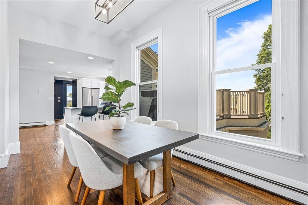 5 Babson Street, Unit 2 Gloucester, MA 01930 - Photo 8 of 23 a view of a dining table chairs and chandelier