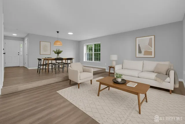 a living room with furniture and a table