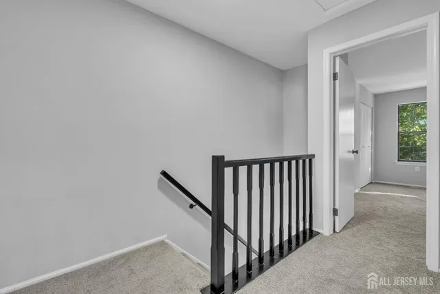 a view of a hallway with closet area