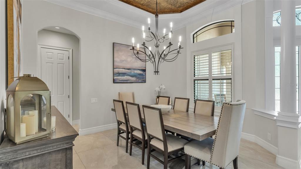 6538 Eagle View Loop Lakeland, FL 33813 - Photo 12 of 89 a view of a dining room with furniture and chandelier