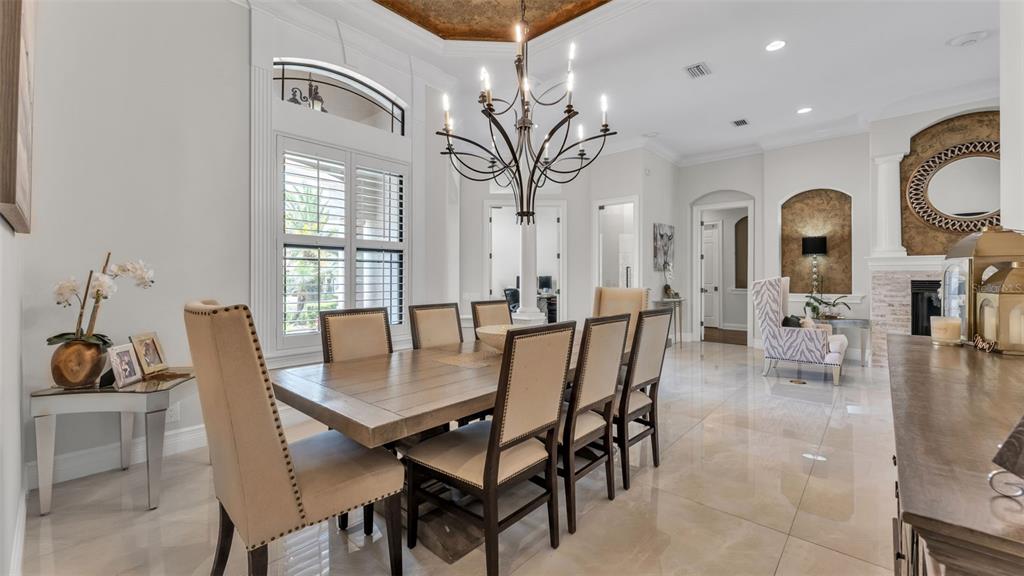 6538 Eagle View Loop Lakeland, FL 33813 - Photo 13 of 89 a view of a dining room with furniture and wooden floor