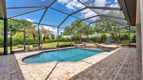 a view of a swimming pool with a patio