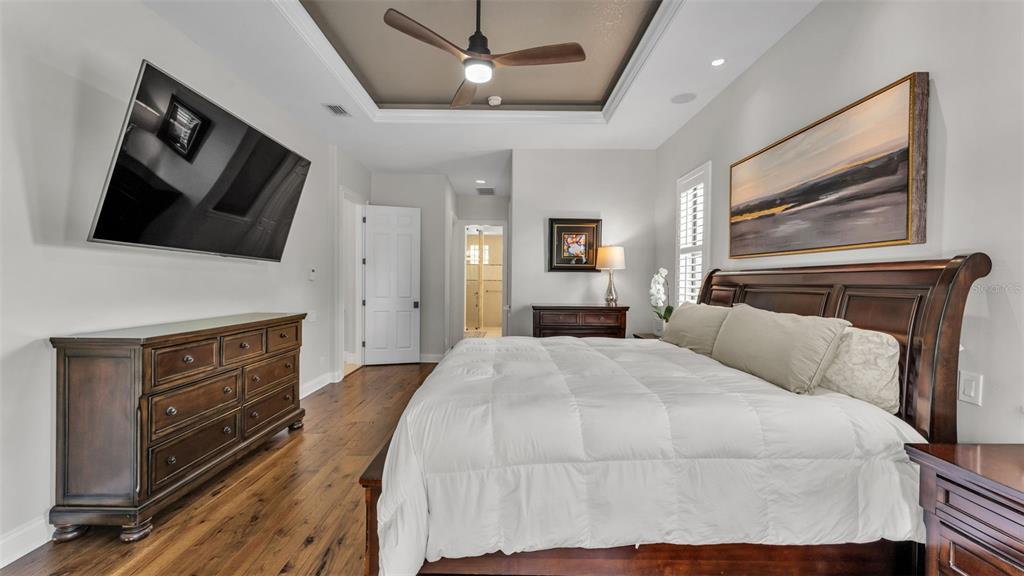 6538 Eagle View Loop Lakeland, FL 33813 - Photo 22 of 89 a bedroom with a bed and a flat screen tv