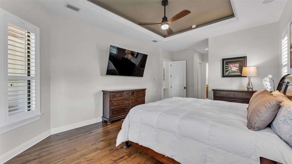 6538 Eagle View Loop Lakeland, FL 33813 - Photo 23 of 89 a bedroom with a bed and a flat screen tv