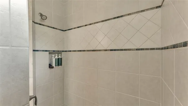 a en suite bathroom with a sink and a mirror