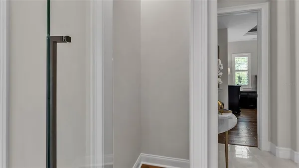 a bedroom with a bed wooden floor and window