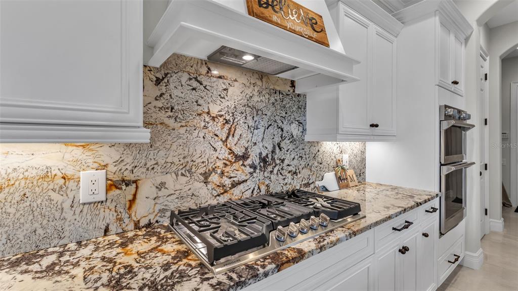 6538 Eagle View Loop Lakeland, FL 33813 - Photo 39 of 89 a kitchen with a stove and a refrigerator