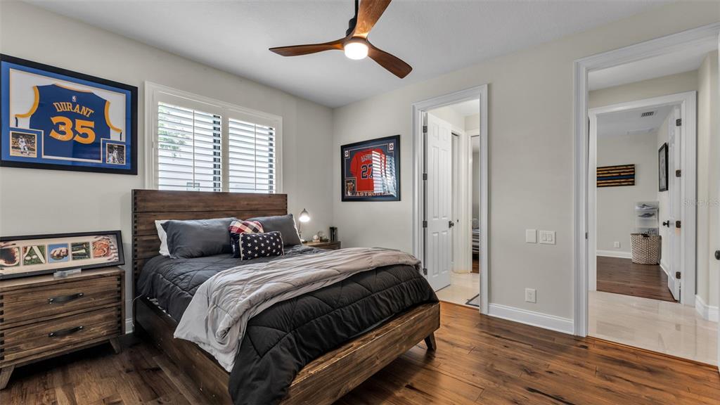6538 Eagle View Loop Lakeland, FL 33813 - Photo 53 of 89 a bedroom with a bed and a painting on the wall