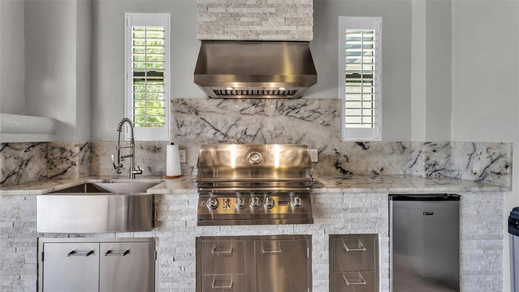 6538 Eagle View Loop Lakeland, FL 33813 - Photo 68 of 89 a kitchen with a stove and a sink