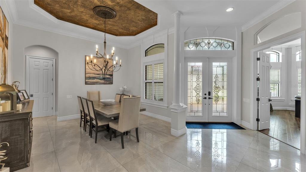 6538 Eagle View Loop Lakeland, FL 33813 - Photo 8 of 89 a view of a dining room with furniture and a chandelier