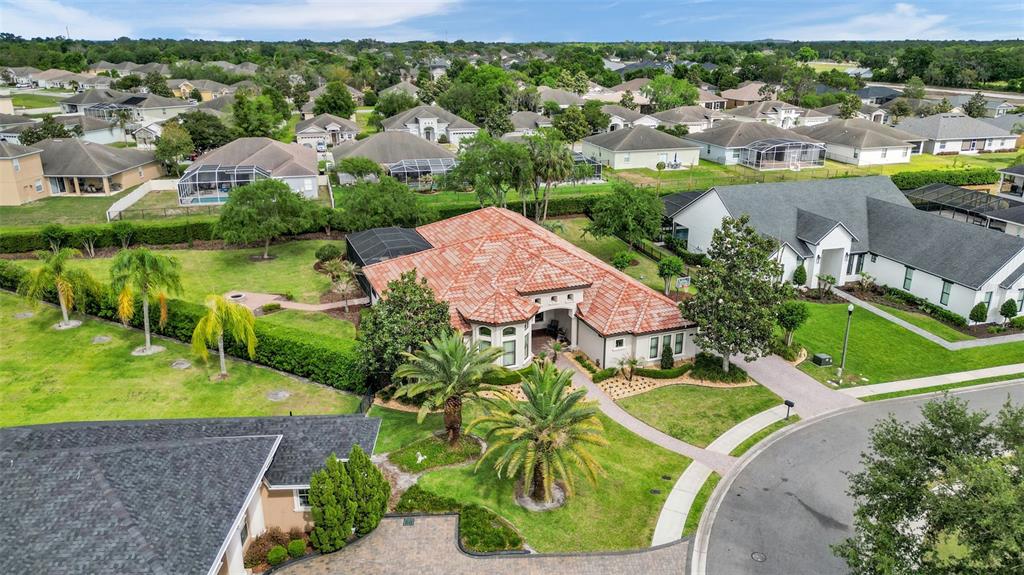6538 Eagle View Loop Lakeland, FL 33813 - Photo 83 of 89 an aerial view of a house with a garden and lake view